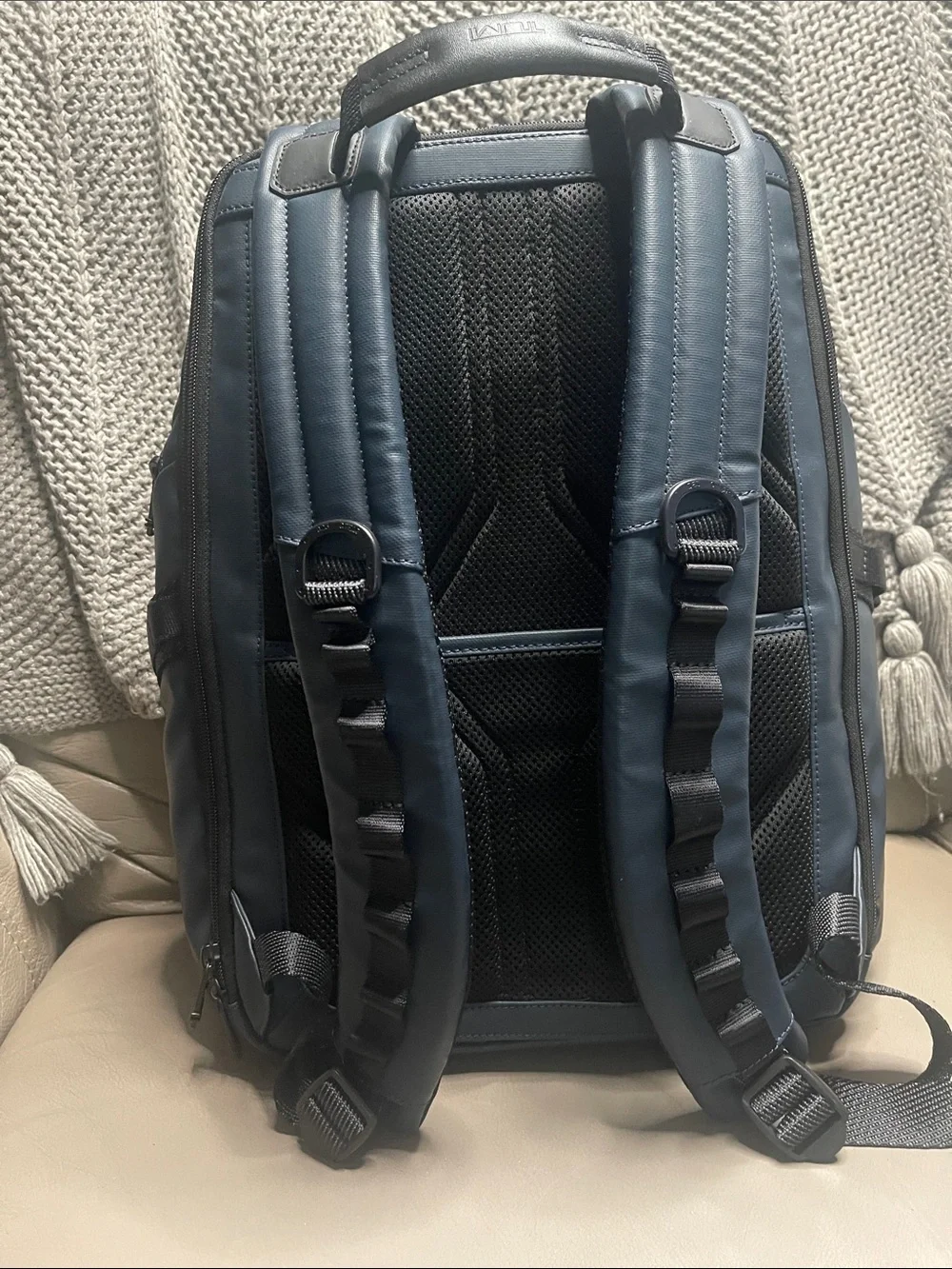 Tumi Men's Blue Travel Backpack with Front Zip Pocket.  It has never been used